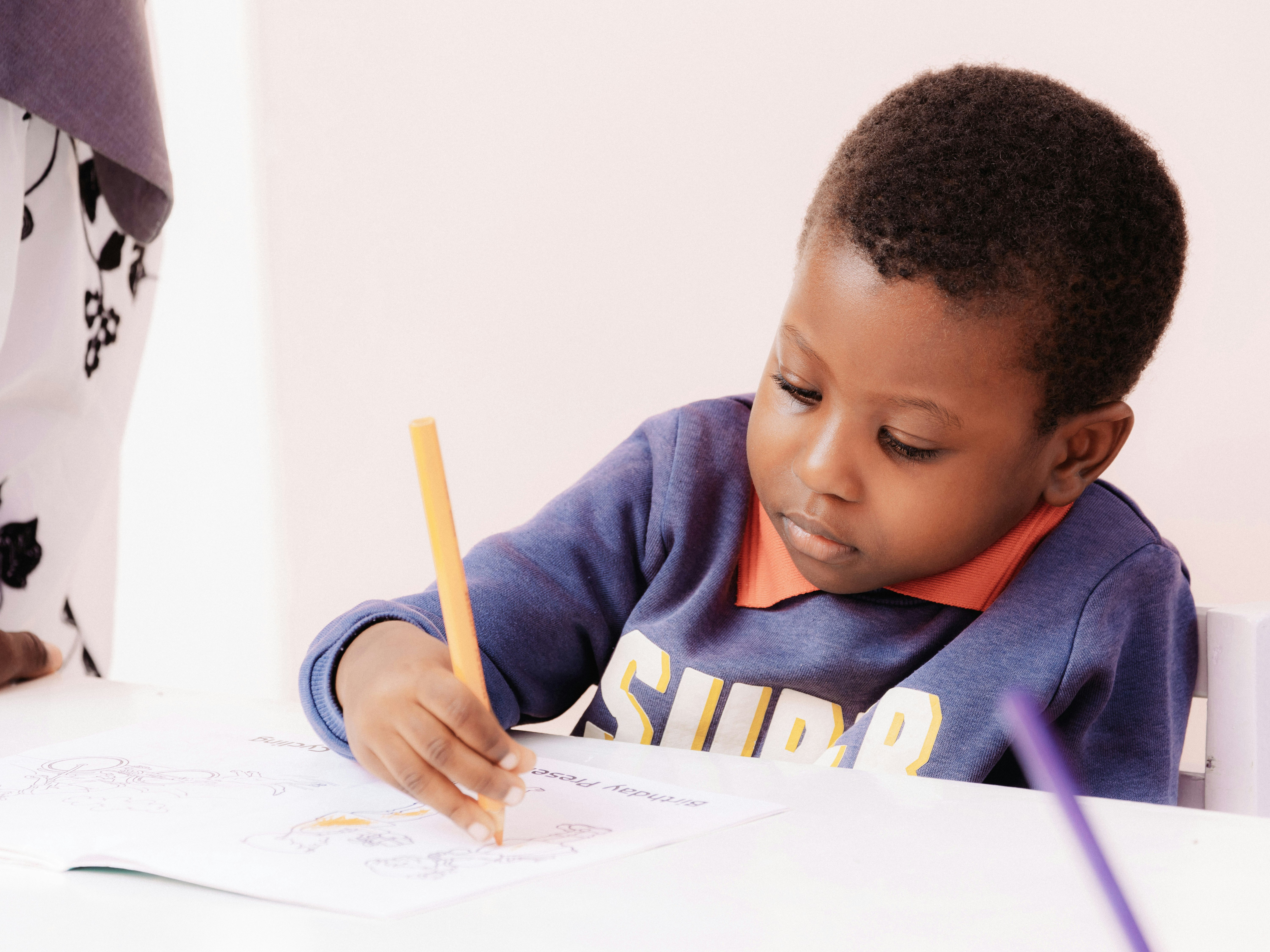 A pupil writing in class